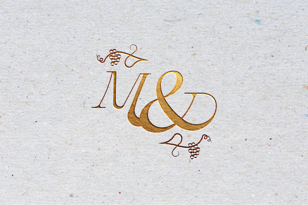 mélanie-et-david-mariage-2021-suisse-logo-écusson-bouteille-de-vin-invitation-carte-graphiste-graphisme-atelier-tertre-étiquette