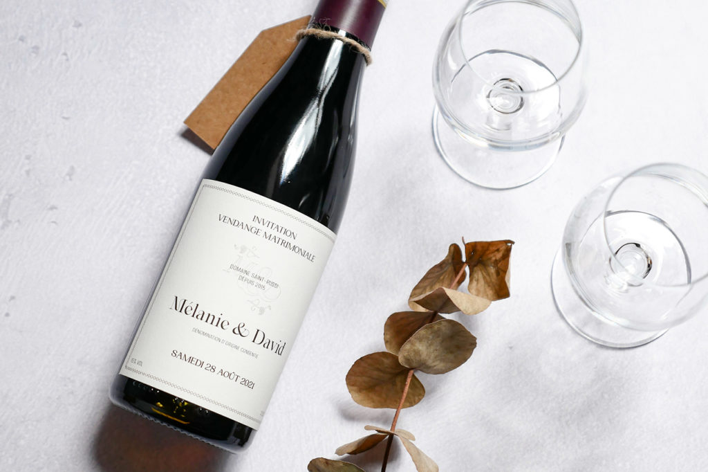 mélanie-et-david-mariage-2021-suisse-logo-vendange-vin-matrimonial-bouteille-de-vin-invitation-carte-graphiste-graphisme-atelier-tertre-étiquette
